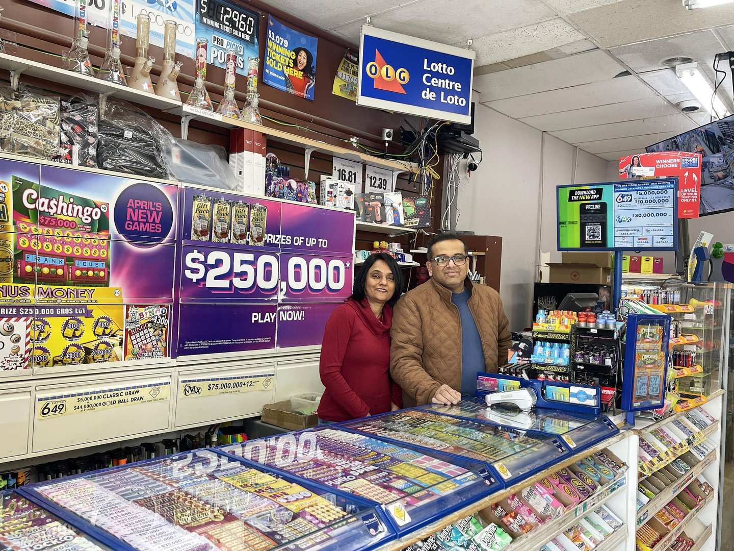 Divya and Paraskumar Shah at the counter inside their Daisy Mart store