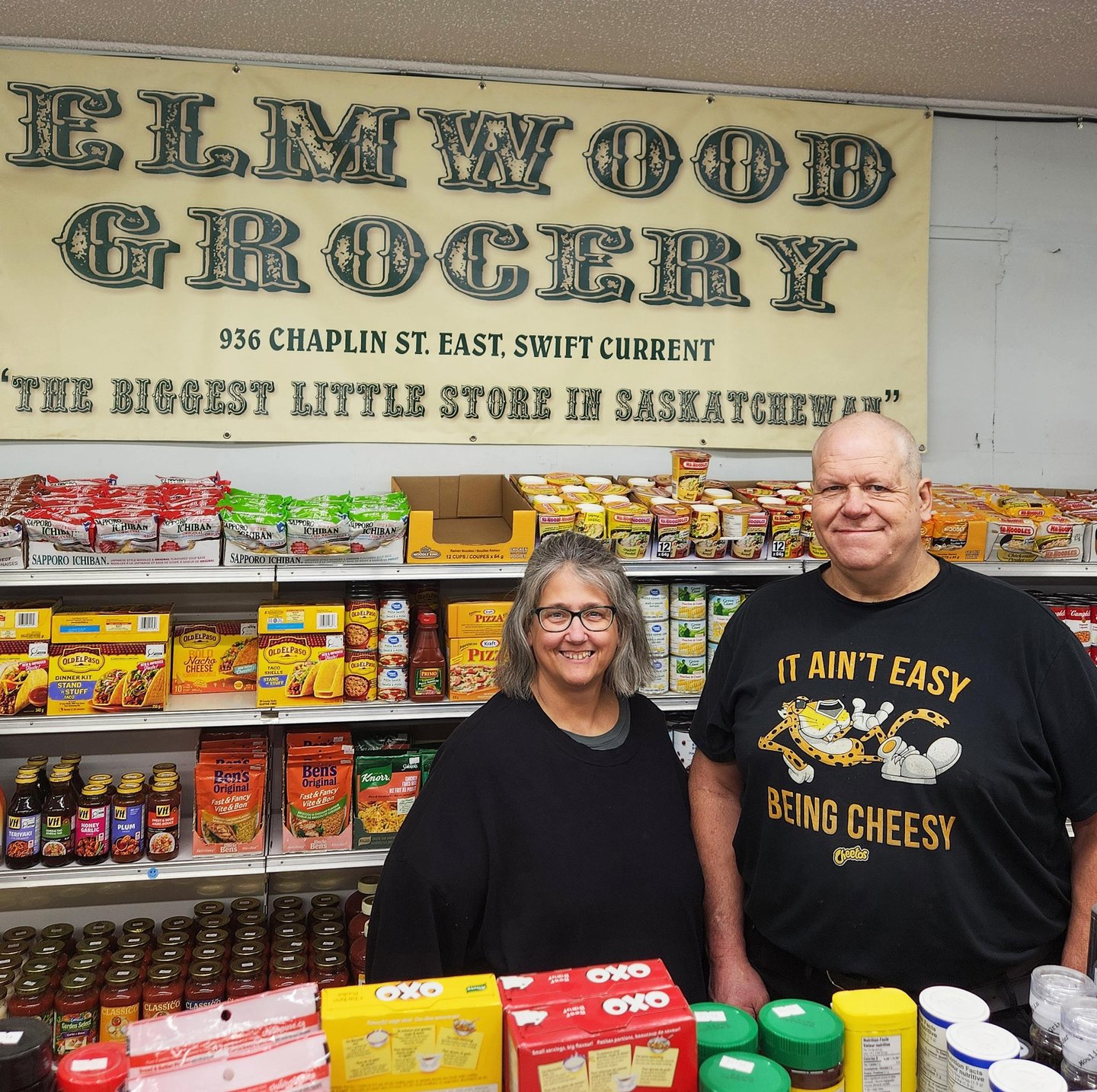 Wendy and Eldon Campbell in front of their Elmwood Grocery counter