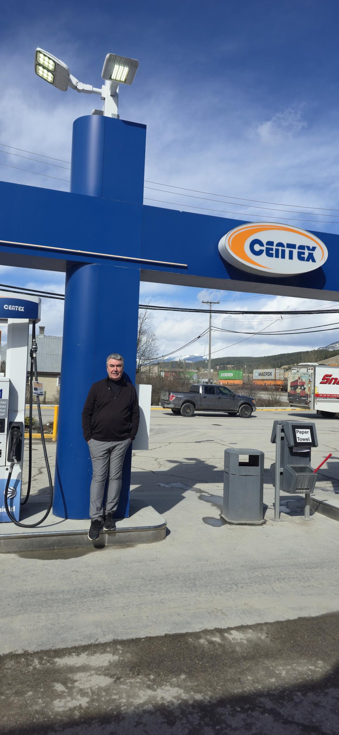 Owner, Mark Baxendale stands in front of the pumps in Mountain Mart's forecourt