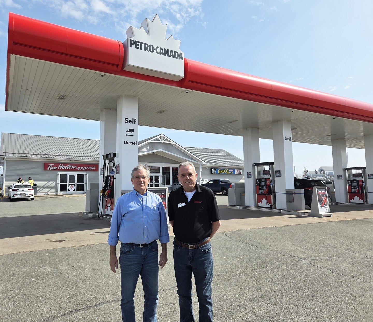 MTM Retail Gas Limited | Masstown Petro-Canada owners standing in the forecourt