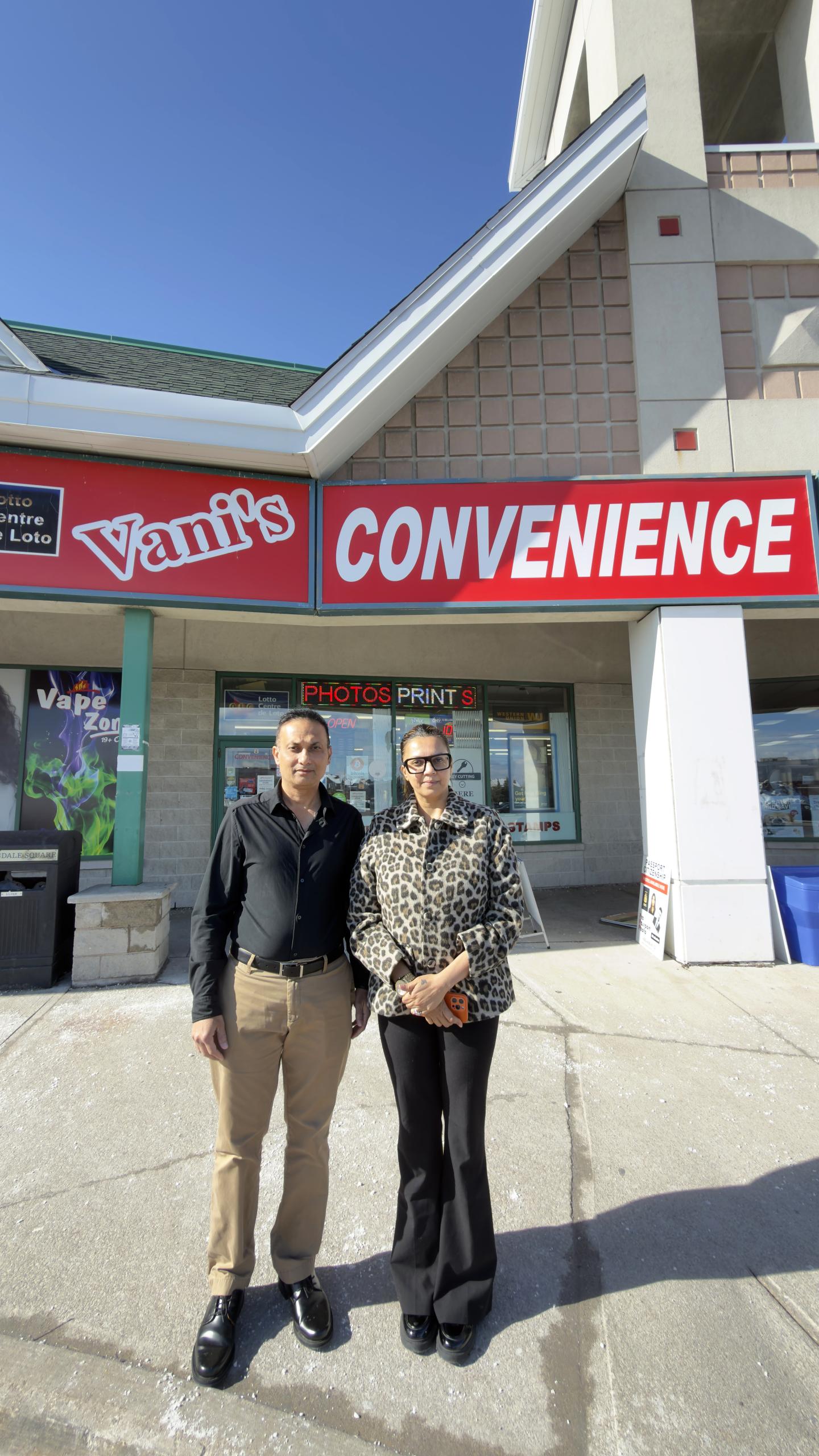 Owners: Vani and Manish Thakker in front of their store, Vani's Convenience