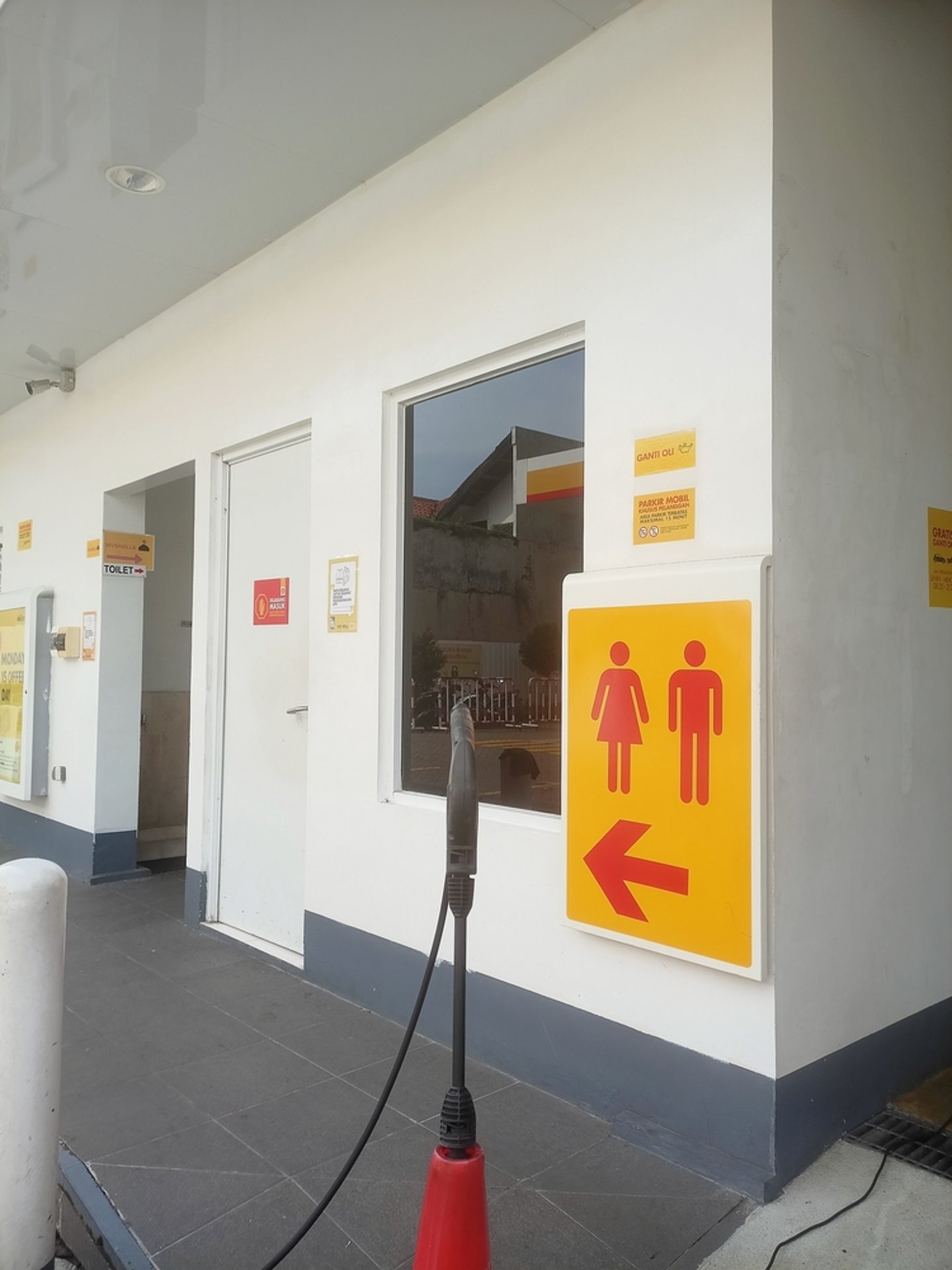 Restroom signage outside a gas station