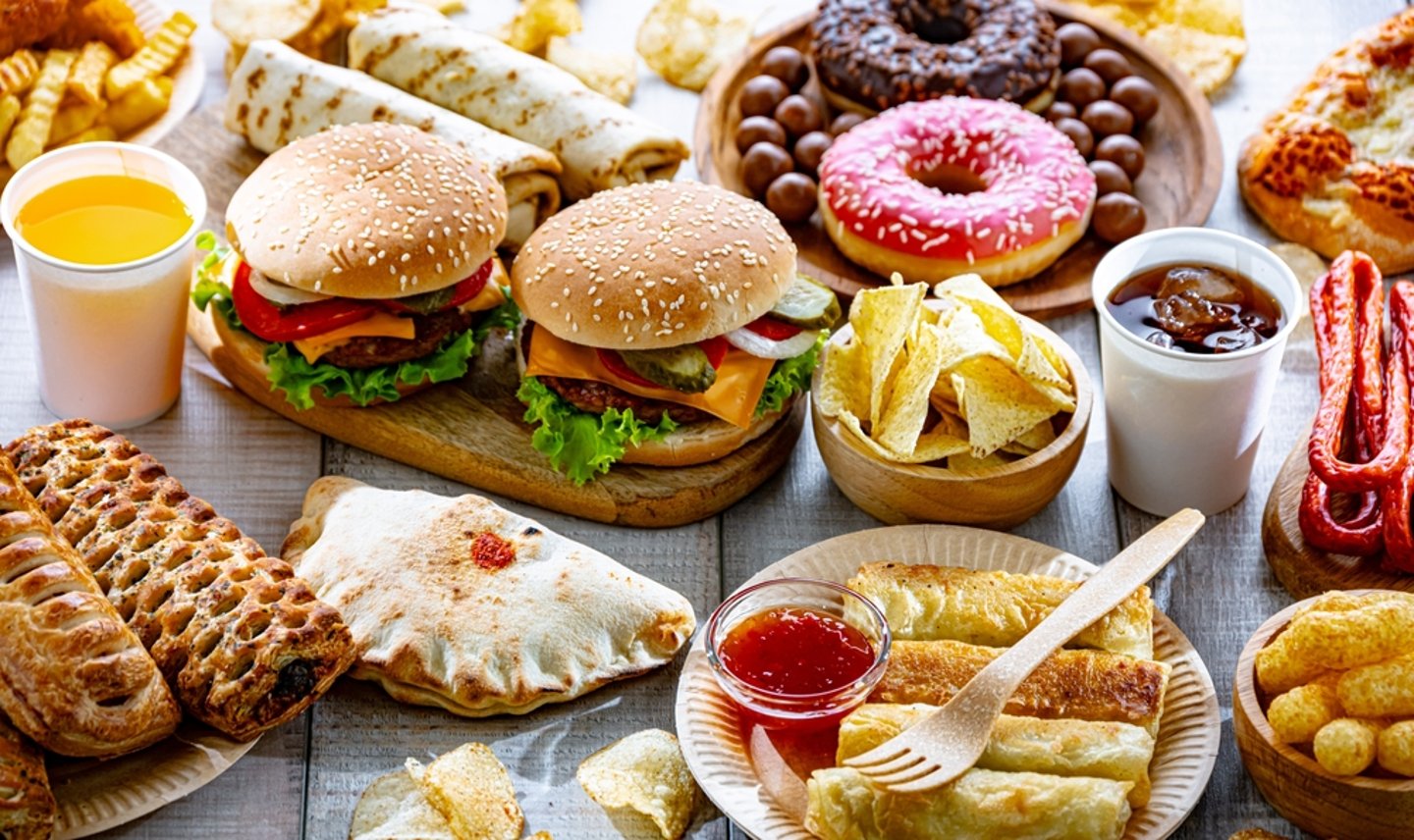 an array of snacks, fast food and soft drinks