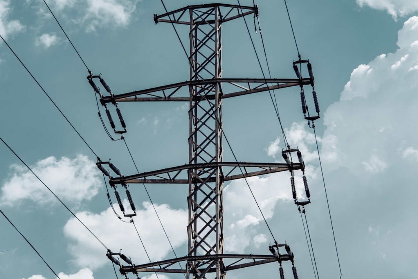 Electrical pylon against a cloudy sky