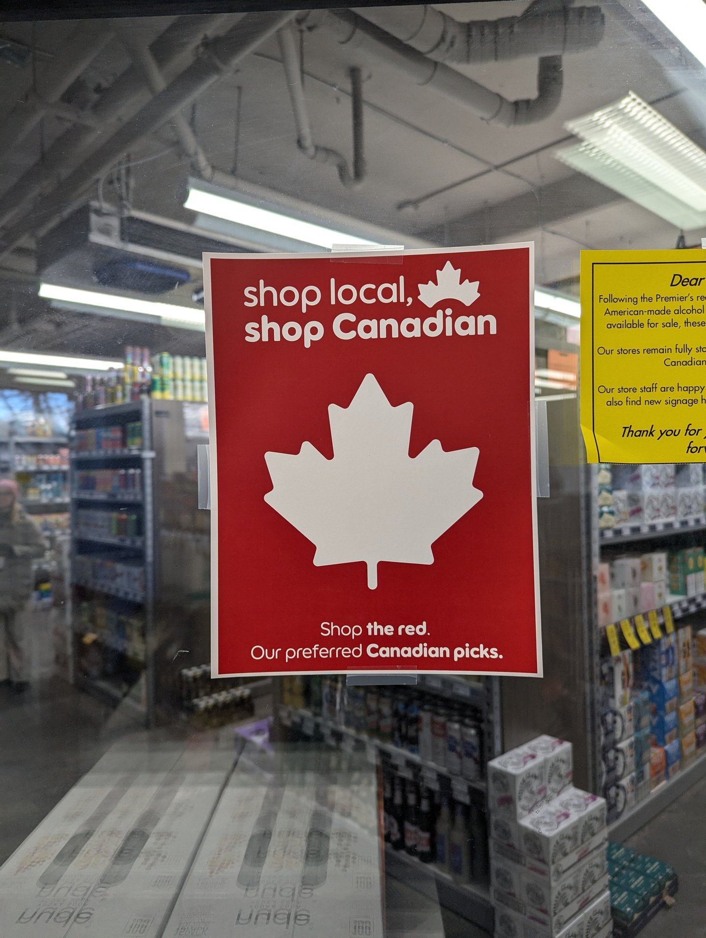 Buy Canadian sign in Banff liquor store