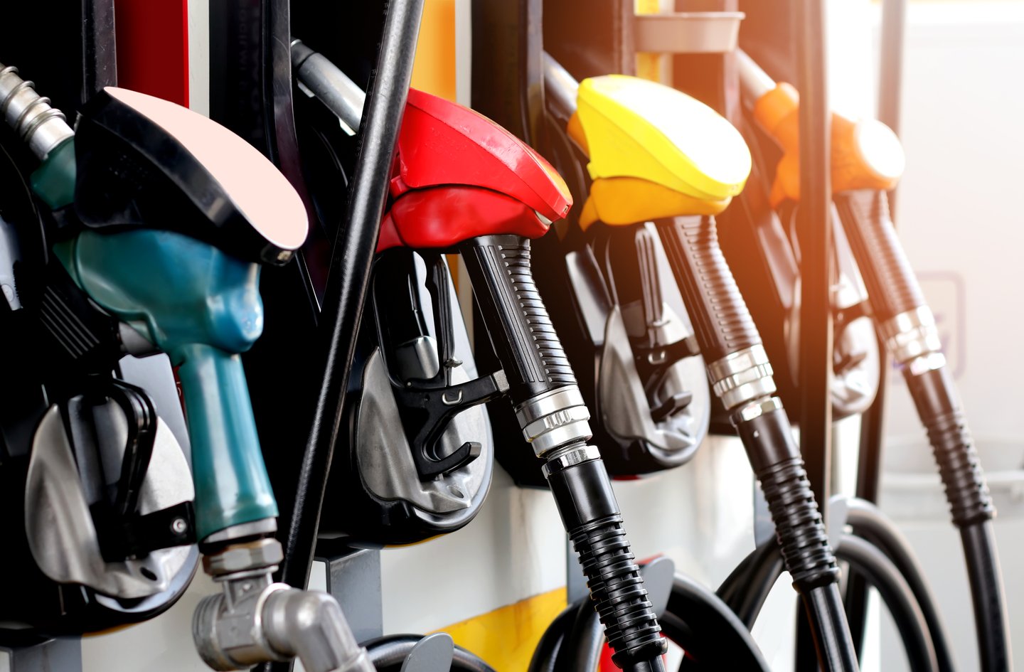 red, green and yellow fuel pumps