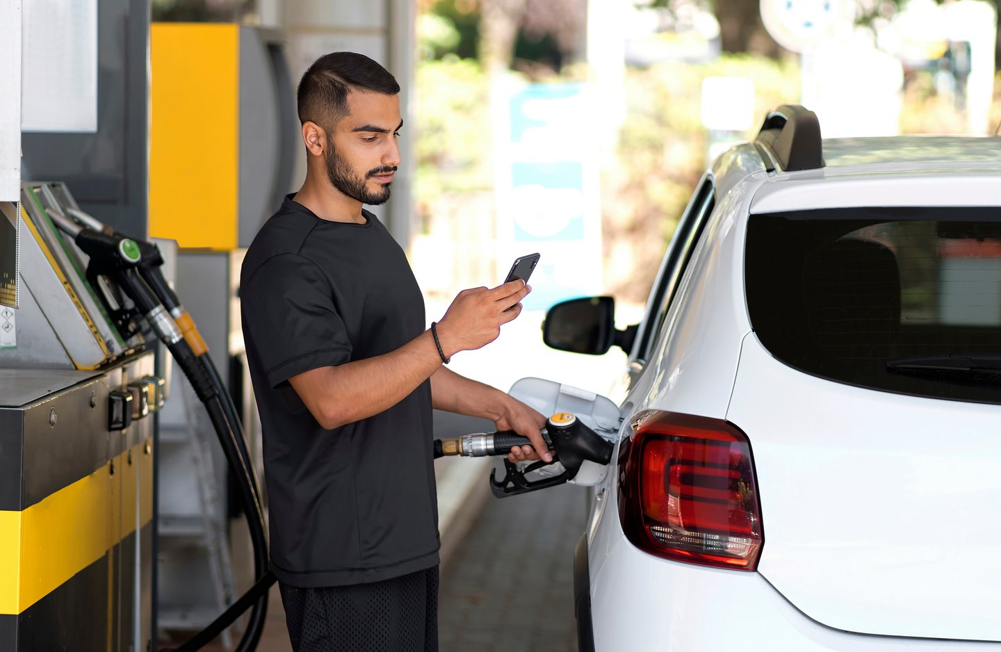 Serious man at gas pump