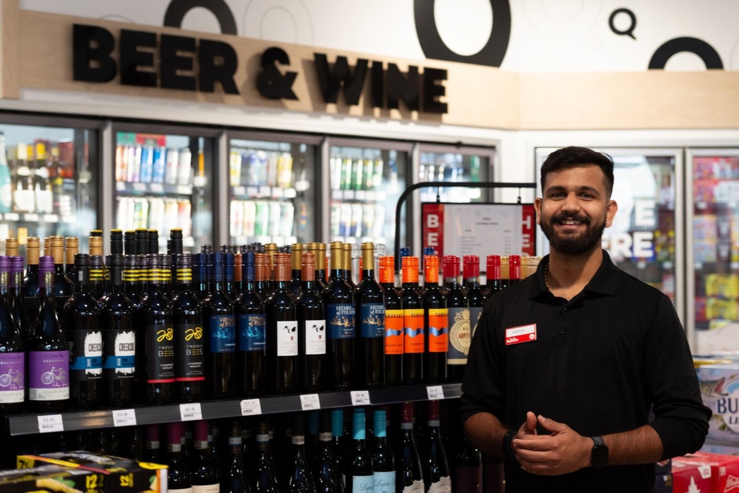 man at wine shelf