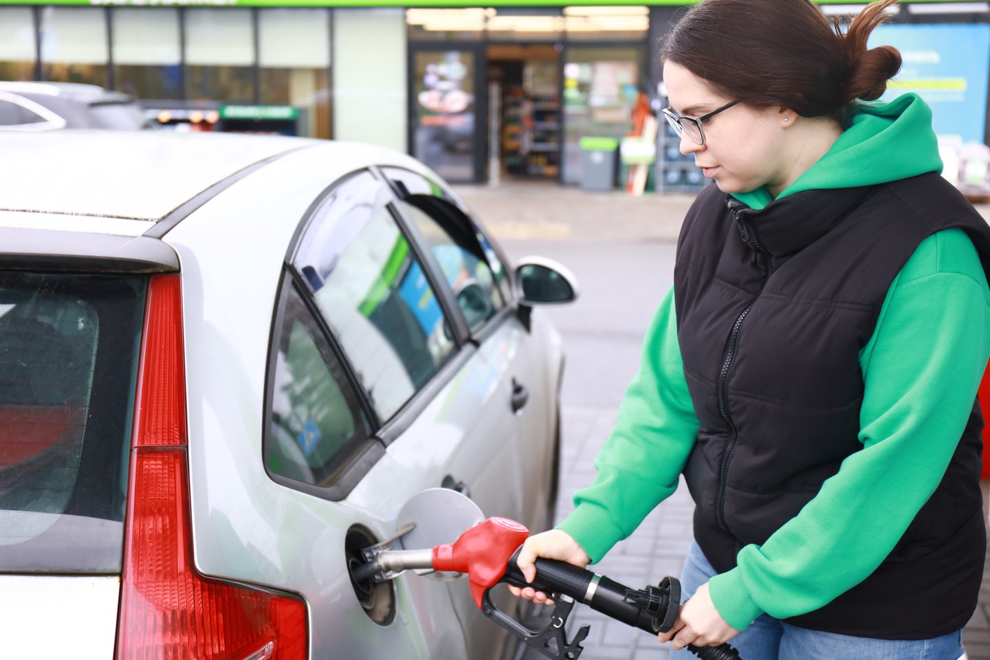 woman pumping gas