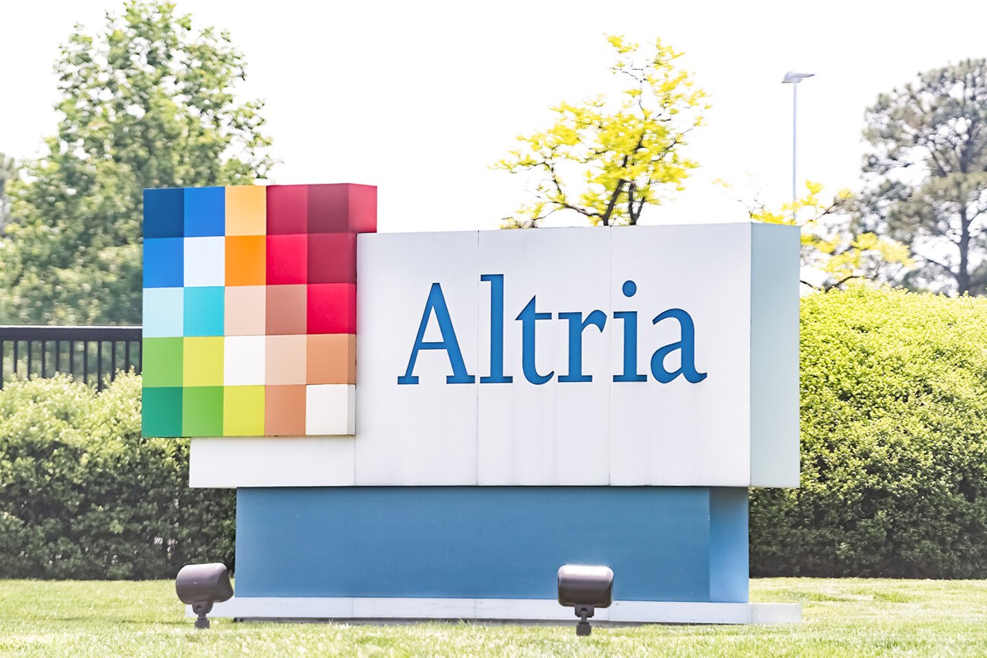 Richmond, USA - May 14, 2018: Altria office sign in Virginia capital city tobacco business closeup by road street, parent company of Philip Morris; Shutterstock ID 1104186455