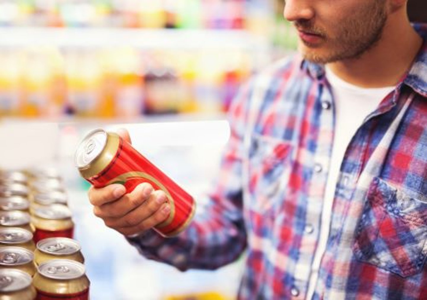 Stock image of man holding beer can