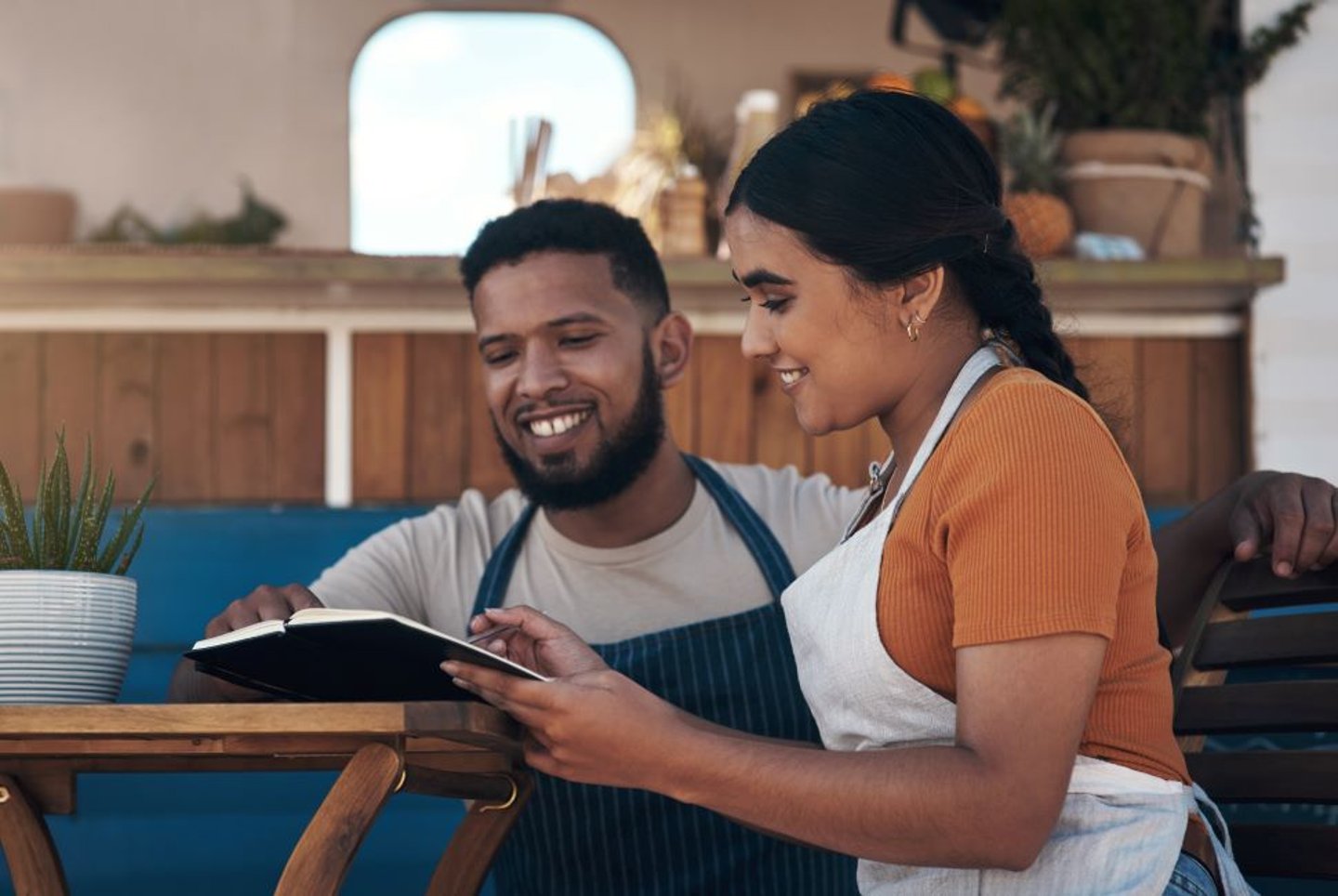 Stock Image of two store owners making plans