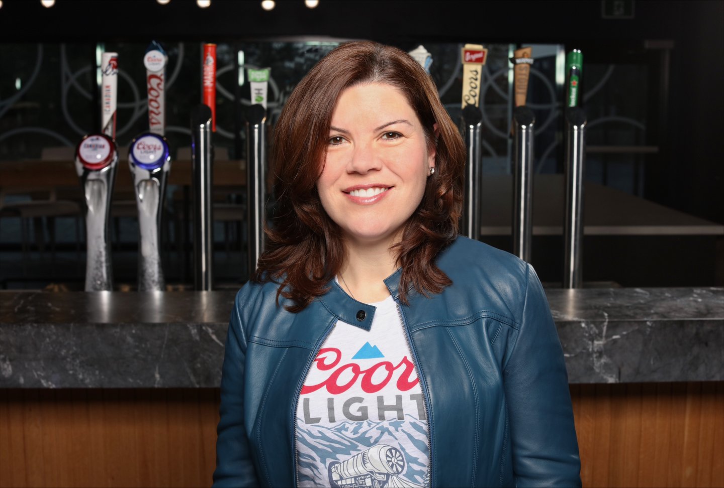 Chantalle Butler in front of brew taps