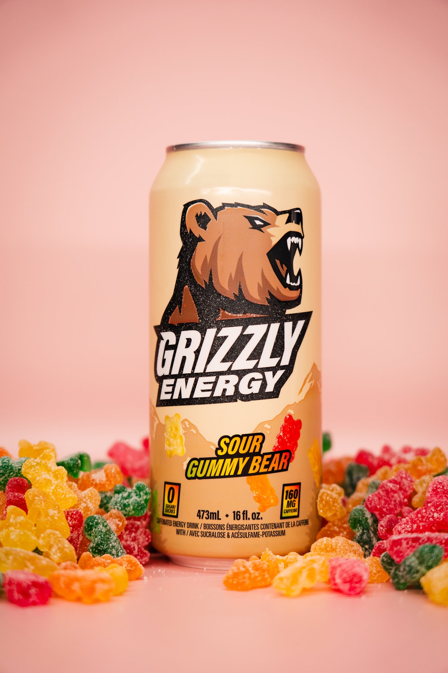 Grizzly Energy Sour Gummy can on pink background