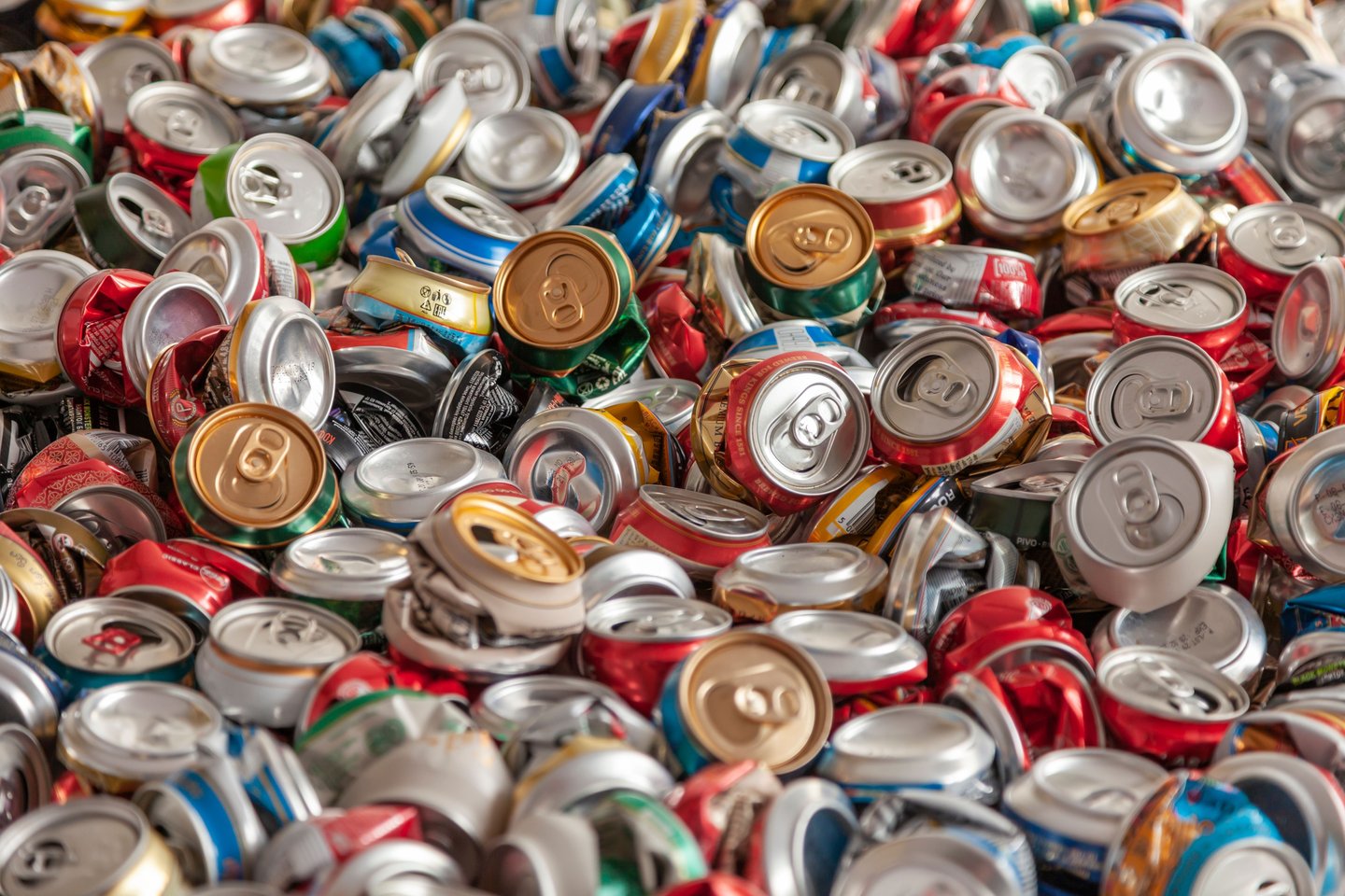 Recycle aluminum metal crushed can waste background. Beer cans garbage will be compressed and baled. Recycling concept.