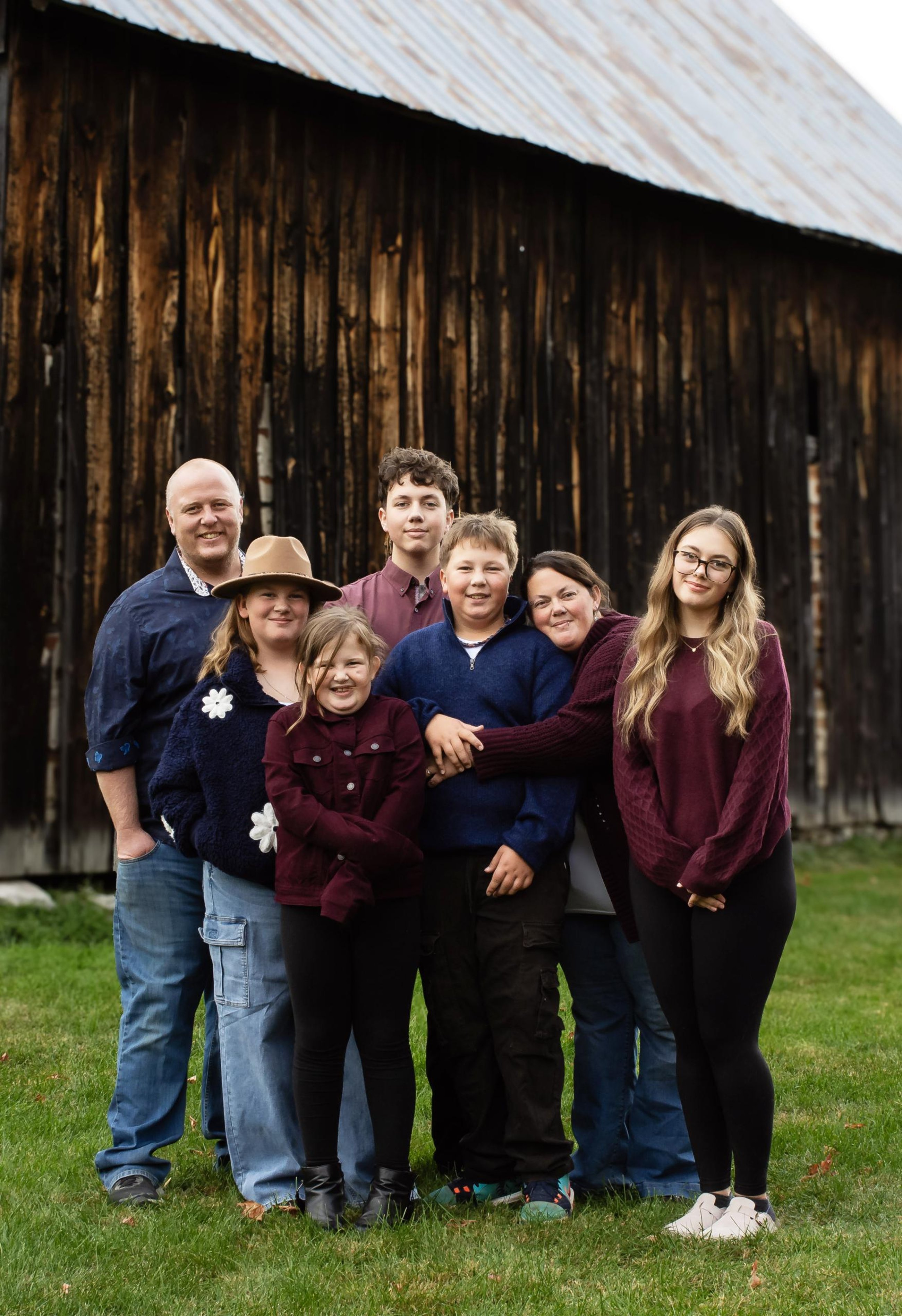 Winners of 2026 OIAC awards and Kenny's Store owners, Amanda and Derek Kenny with their family