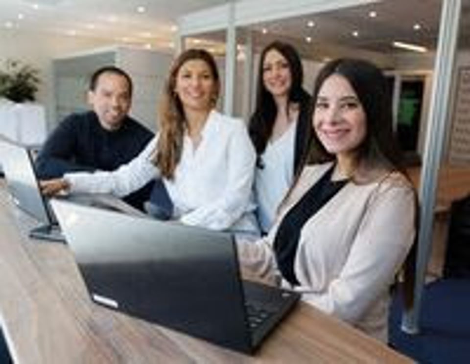 BAT Employees sitting at a table