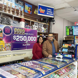 Divya and Paraskumar Shah at the counter inside their Daisy Mart store