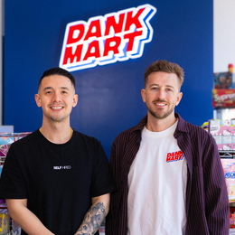 Kevin Wong (left) and Mike Smaill (right) in front of their counter with Dank Mart sign behind them.