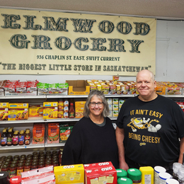 Wendy and Eldon Campbell in front of their Elmwood Grocery counter