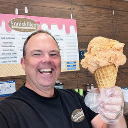 Enniskillen General Stores owner, Thomas Sheehan holding an ice cream cone.