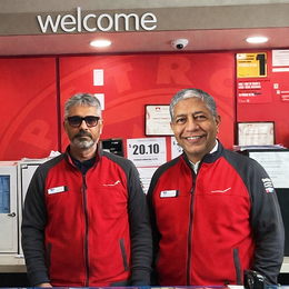Udayan Pandya and Ketan Dave in front of their counter at the Green Mountain Petro-Canada