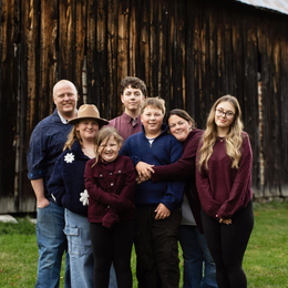 Winners of 2026 OIAC awards and Kenny's Store owners, Amanda and Derek Kenny with their family