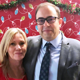 Red Pine and Golden Eagle owners,  Tracey Bullock and Todd Nadon in front of a festive background.