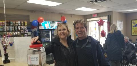 Car wash customers and workers at the first annual Car wash for a Cure.