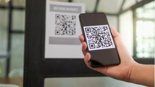 Man scanning tag accepted generate digital pay without money.scanning QR code online shopping cashless technology concept