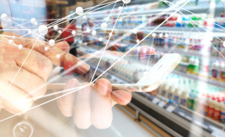 Deep learning , Neural networks , Machine learning and artificial intelligence concept. Atom connect with hand holding mobile phone and blur retail shop store background