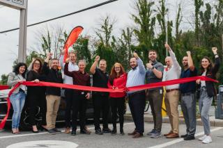 Cutting the ribbon on the new EV charging station in Quebec.
