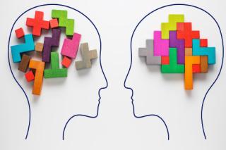 The concept of rational and irrational thinking of two people. Heads of two people with colourful shapes of abstract brain for concept of idea and teamwork. Two people with different thinking.