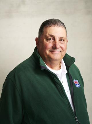 A smiling Anthony Magnini wearing a green fleece