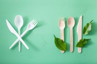 harmful plastic cutlery and eco friendly wooden cutlery. plastic free concept