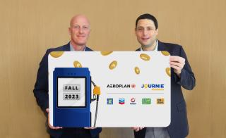 Parkland and Aeroplan CEOS holding big cheque