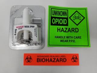 Naloxone spray with warning labels. Naloxone is sold under the brand name of Narcan and is used to treat overdoses from heroin, Fentanyl, and opiates.