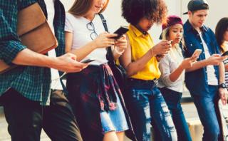 Group of Gen Z people on their phones
