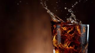 Cola Drink Splashing out of Glass Shutterstock