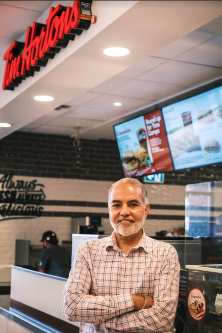 Barj Dhahan in front of Tim Hortons