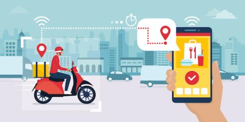 Food delivery app on a smartphone tracking a delivery man on a moped with a ready meal, technology and logistics concept, city skyline in the background