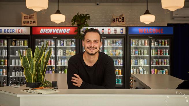 Manager Fres Masse stands behind the counter