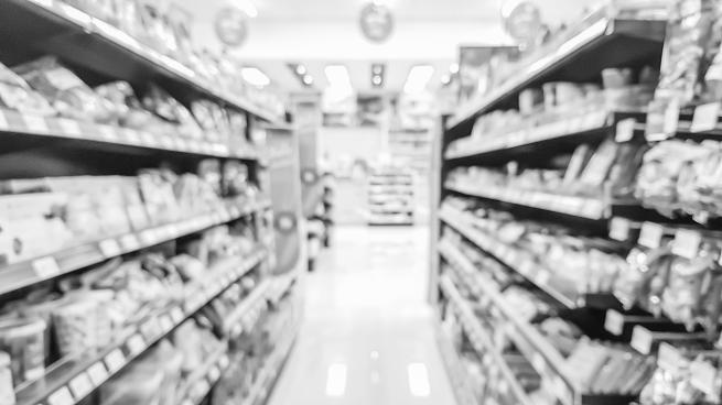 Blurred image of product shelves in convenience stores in black and white