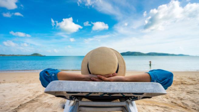  Young woman relaxing on beach, ocean view, Vacation Outdoors Seascape Concept