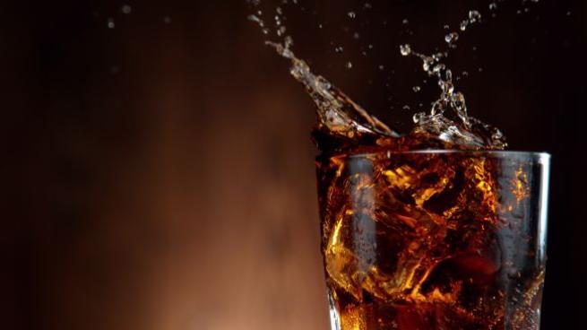 Cola Drink Splashing out of Glass Shutterstock