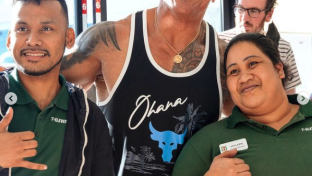 The Rock poses with 7-Eleven employees