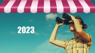 woman looking through binoculars under canopy