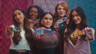 Five young women from Hershey Canada's HerShe campaign hold up chocolate bars.