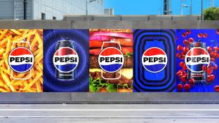 Pepsi's new logo on products displayed on an outdoor ad wall