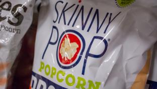 Bag of Skinnypop popcorn on a shelf